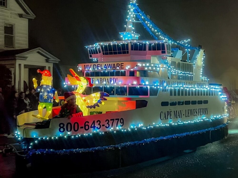 A photo of the Cape May - Lewes Ferry Float decorated for a winter holiday parade in Lewes Delaware