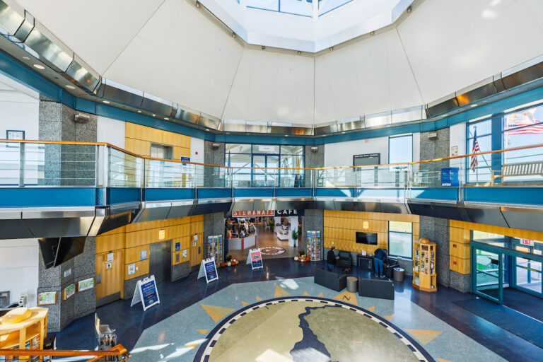 The interior of the Cape May Ferry Terminal from the second floor looking toward the Stowaways Cafe and the Map of the Bay on the floor