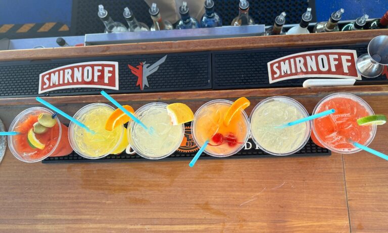 A colorful assortment of 6 cocktails lined up on the Ferry's Lido Bar