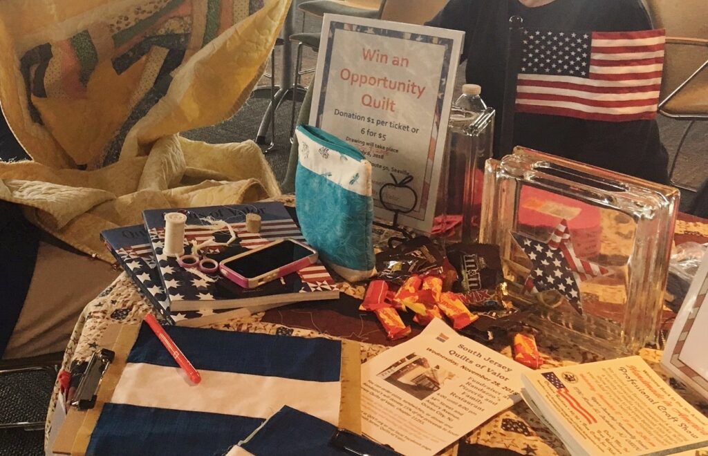 Quilting organization table spread at an event