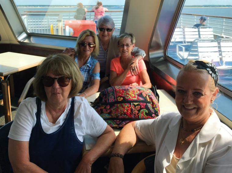photo of 5 middle-aged women who are sisters on the Ferry
